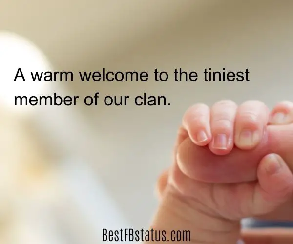 A new born baby's hand holding an adult's finger with the text: "A warm welcome to the tiniest member of our clan."